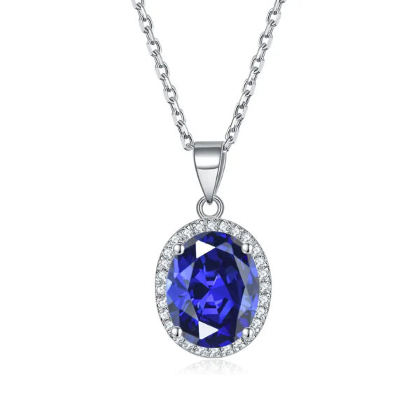 Featuring a rich blue zirconia encircled by dazzling diamonds